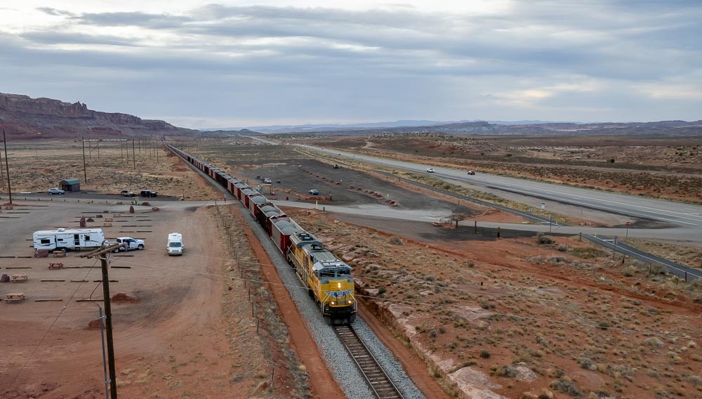 A train passes a parking area for the Gemini Bridges 4x4 trail north of Moab, Utah.
