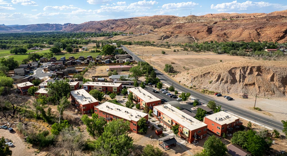 aerial view of Cinema Court Apartments, with neighboring single-family homes in the background