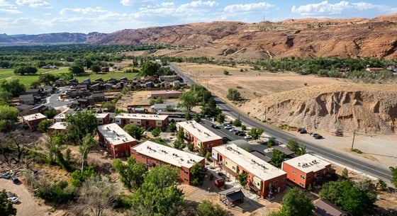 aerial view of Cinema Court Apartments, with neighboring single-family homes in the background